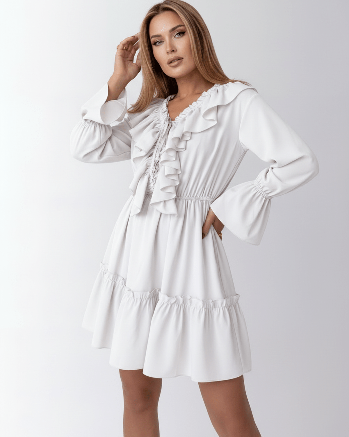 Lauven Luna Mini Dress featuring ruffled V-neck, elastic waist, and bell cuffs for a feminine silhouette.