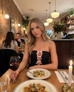 Luna Mini Dress by Lauven, strapless black bodycon dress with bow-tie cut-out detail, perfect for an evening out.