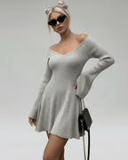 Luna Mini Dress by Lauven in light gray knit with V-neck and flared sleeves, showcasing a stylish silhouette.