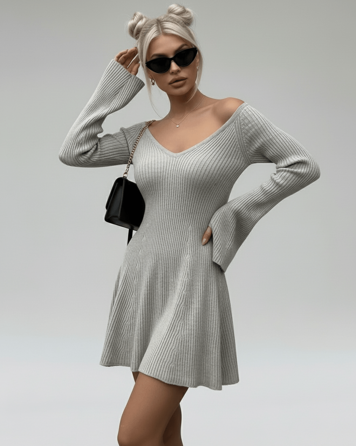 Model wearing the Lauven Luna Mini Dress, a light gray knit with V-neck and flared sleeves, stylish and chic.
