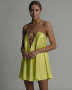 Luna Mini Dress by Lauven in vibrant chartreuse satin with beaded spaghetti straps and hollow V-neckline.