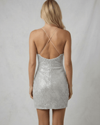 Luna Mini Dress by Lauven in silver sequins featuring crisscross straps and a flattering fit from the back.