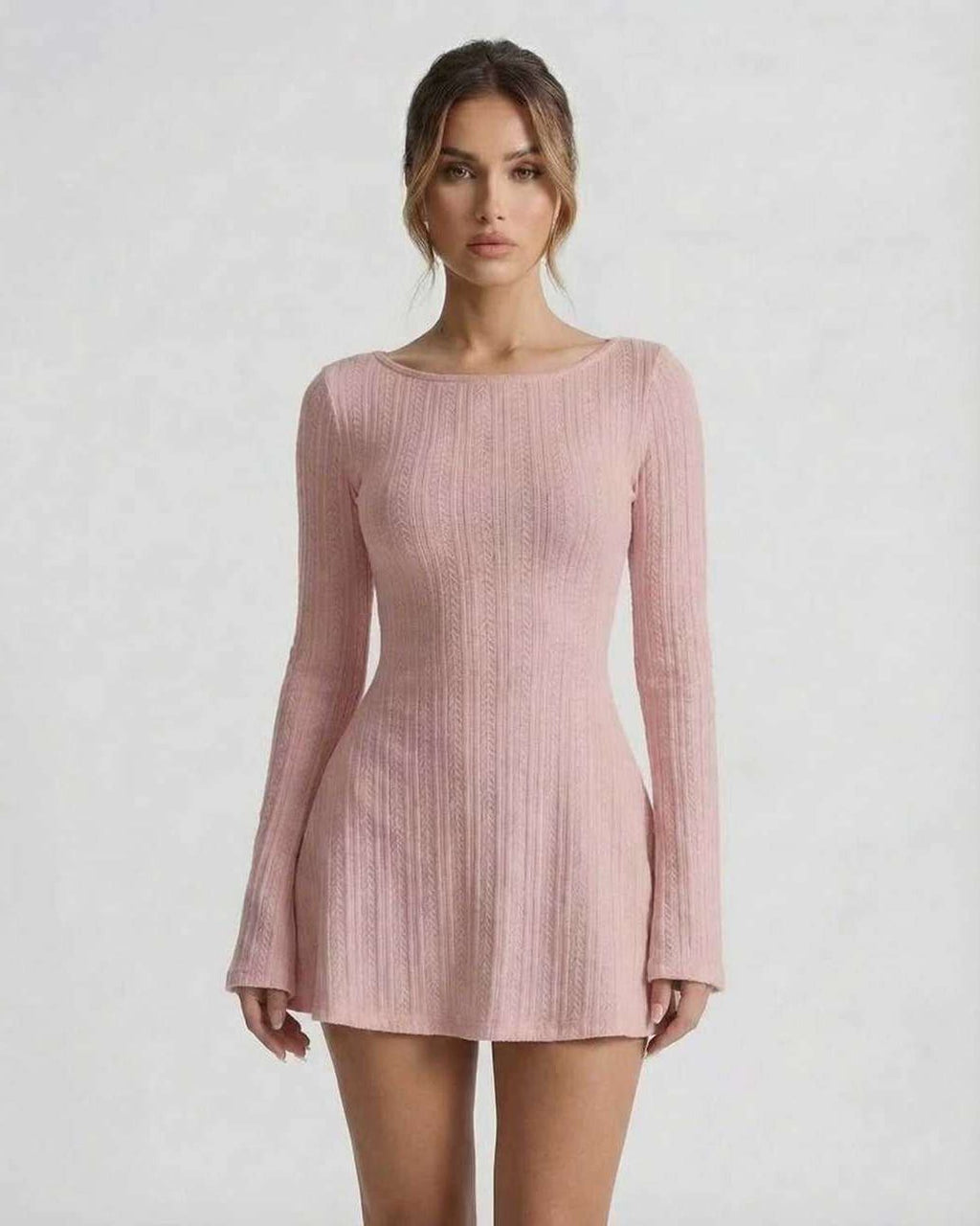 Luna Mini Dress - Soft pink long sleeve cable knit dress by Lauven, featuring flared sleeves and a backless design.