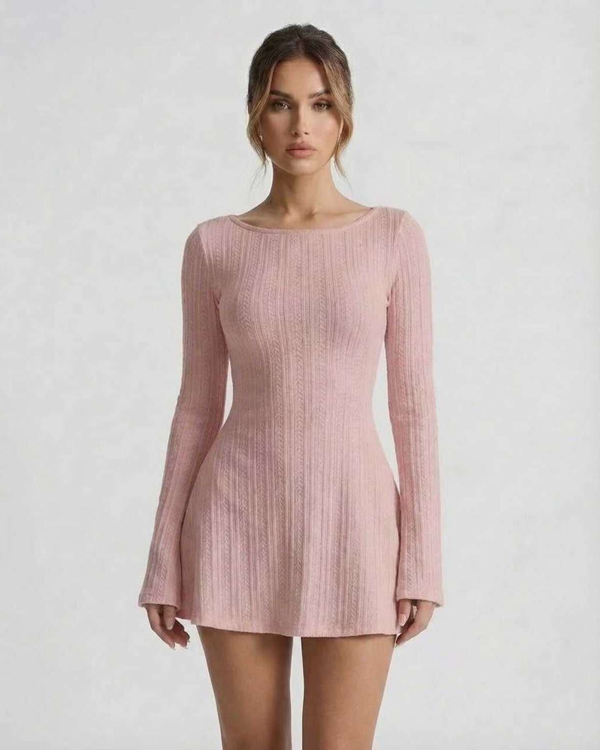 Luna Mini Dress - Soft pink long sleeve cable knit dress by Lauven, featuring flared sleeves and a backless design.