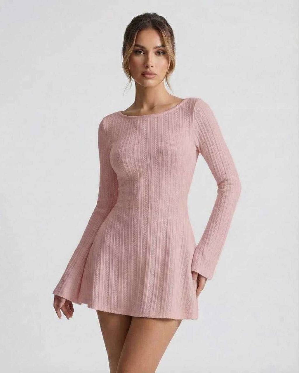 Luna Mini Dress featuring soft pink cable knit, long flared sleeves, and backless design by Lauven.