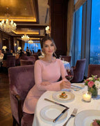 Luna Mini Dress in soft pink cable knit, featuring long sleeves and elegant backless design, by Lauven.