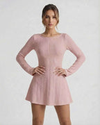 Luna Mini Dress in soft pink cable knit, long sleeves, backless design from Lauven, featuring cozy silhouette and intricate texture.