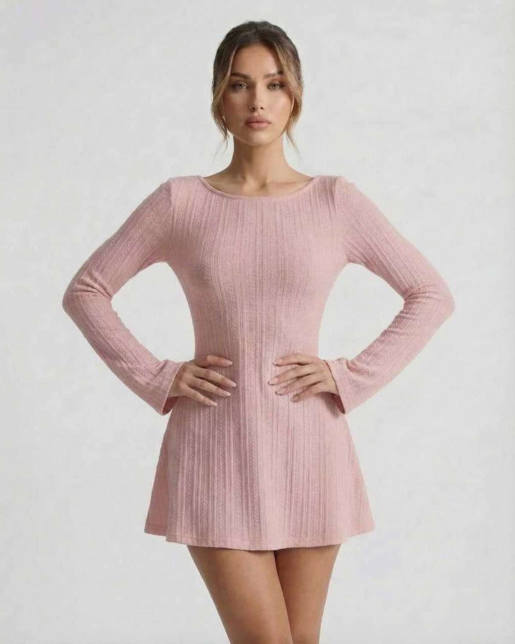 Luna Mini Dress in soft pink cable knit with long flared sleeves, backless design, by Lauven.
