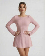Luna Mini Dress in soft pink cable knit with long flared sleeves, backless design, by Lauven.