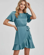 Lauven Luna Mini Dress in serene teal, featuring soft satin finish, tie waist, ruffle hem, and flutter sleeves.