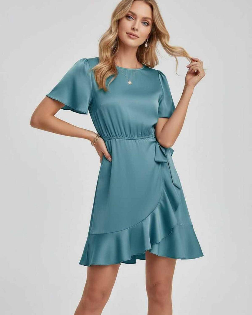 Lauven Luna Mini Dress in teal with soft satin finish, ruffle hem, flutter sleeves, and tie waist.