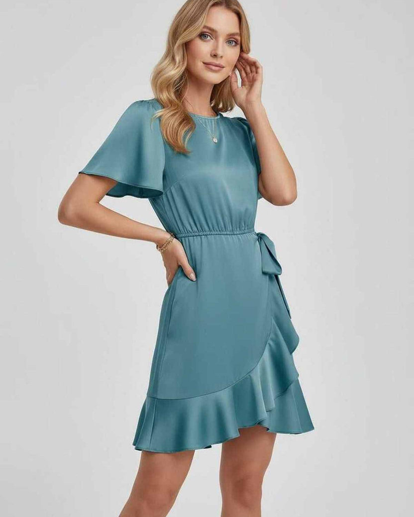 Lauven Luna Mini Dress in serene teal with soft satin finish, ruffle hem, and tie waist for a charming spring look.