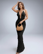Lunara Maxi Dress in black, featuring a textured polyester blend, halter V-neck, perfect for warm-weather styling by Lauven