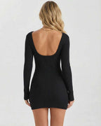 Lunara Mini Dress back view, sleek black ribbed knit, bodycon silhouette, Lauven brand, modern square neckline.