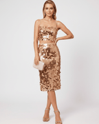 Lustra Sequin Set featuring a high-shine two-piece design with a cropped top and midi skirt, by Lauven.