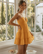 Marbella Mini Dress in mustard orange, halter V neck, tiered ruffle skirt, breathable comfort from Lauven.