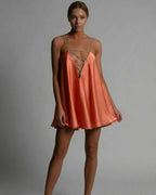 Marigold Mini Dress by Lauven - Satin flared silhouette in burnt orange with beaded spaghetti straps. Perfect for summer.