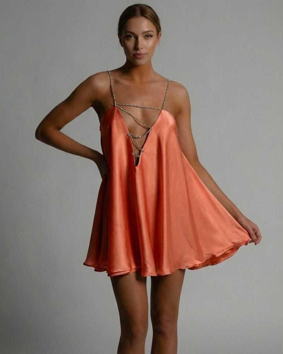 Lauven Marigold Mini Dress in radiant burnt orange satin with a flared skirt and beaded spaghetti straps.