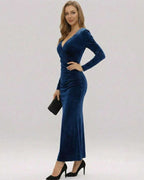 Model wearing Lauven Marina Maxi Dress in deep navy velvet, featuring a V-neckline and long sleeves.