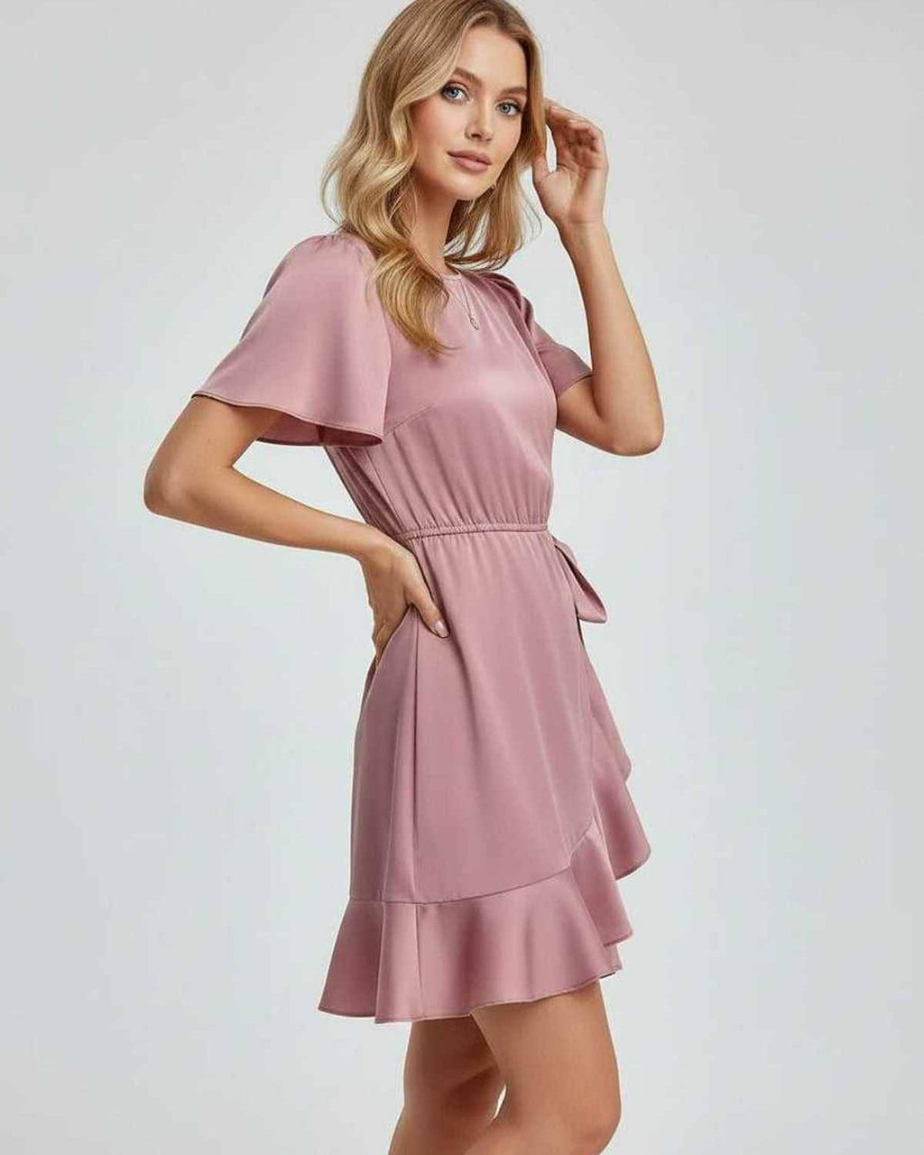 Lauven Marina Mini Dress featuring elegant ruffle detailing and a flattering silhouette with flutter sleeves.