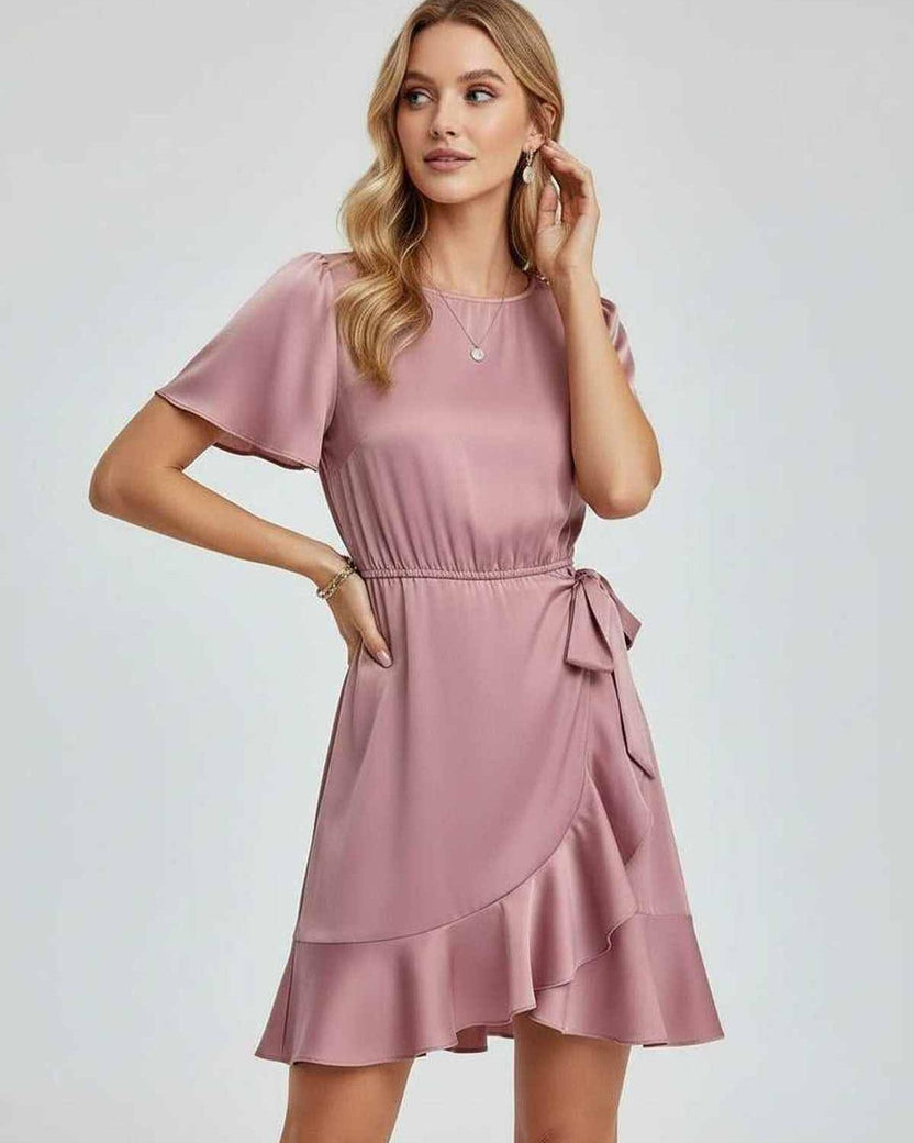 Lauven Marina Mini Dress with elegant ruffle detailing, tie waist, and flutter sleeves in soft pink color.
