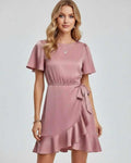 Lauven Marina Mini Dress in soft pink with elegant ruffle detailing and tie waist, perfect for spring and summer.