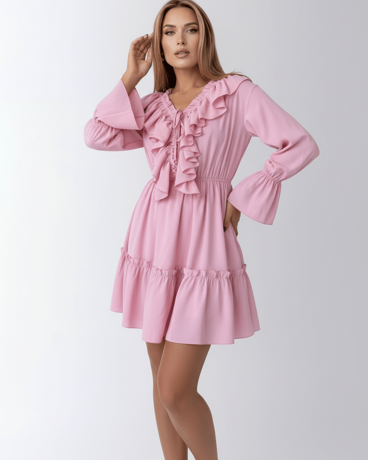 Marina Mini Dress by Lauven in pink, featuring ruffles, elastic waist, V-neckline, and flared sleeves.