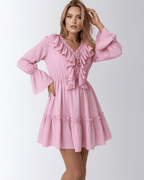 Lauven Marina Mini Dress in pink with ruffles and elastic waist, featuring long sleeves and flared cuffs.