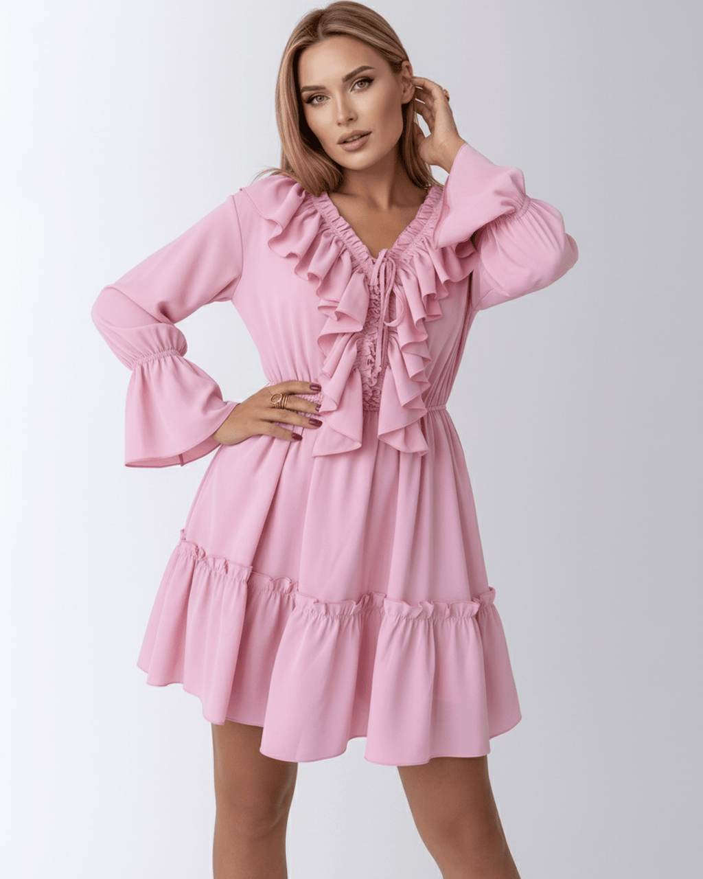 Lauven Marina Mini Dress in pink featuring ruffles, elastic waist, and flared sleeves for a feminine look.