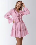 Lauven Marina Mini Dress in pink with ruffles and elastic waist, featuring a V-neckline and flared sleeves.