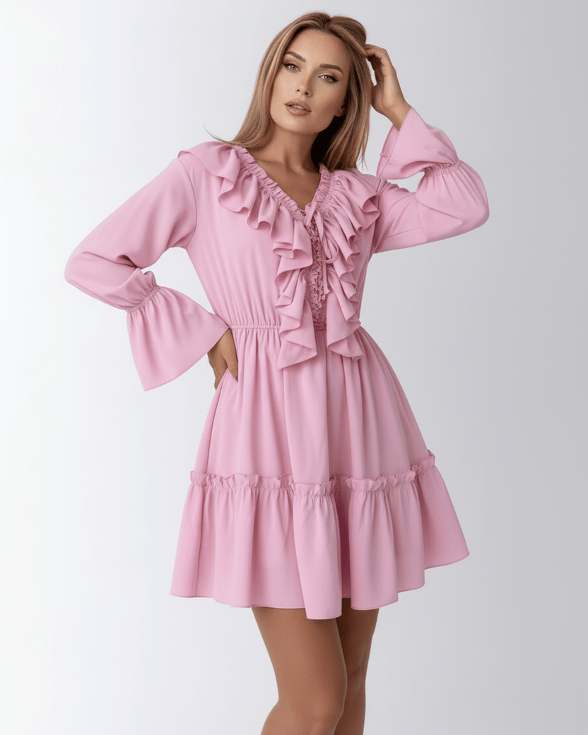 Lauven Marina Mini Dress in pink with ruffles and elastic waist, featuring a V-neckline and flared sleeves.