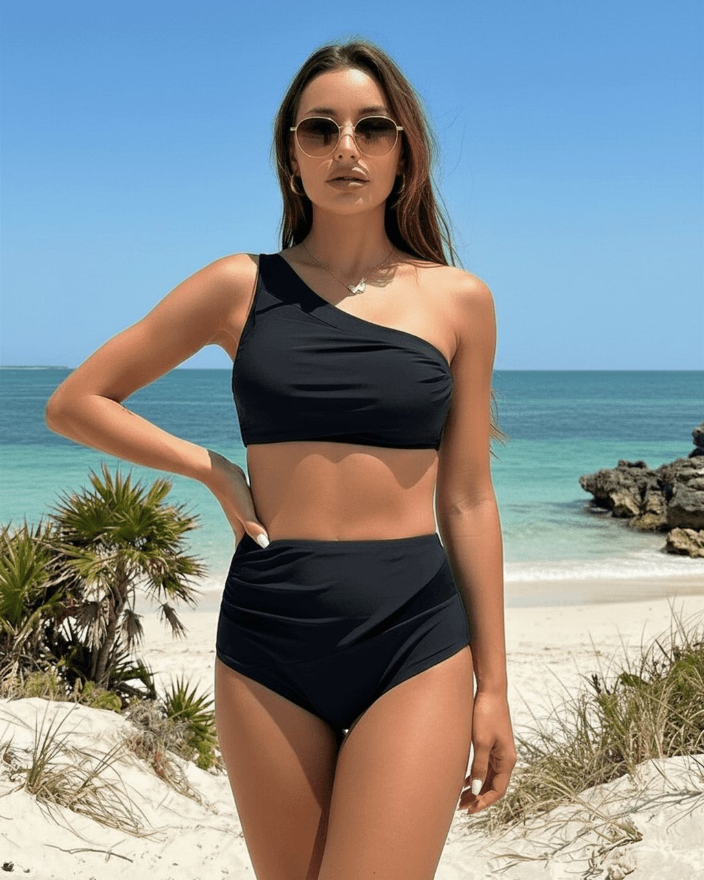 Midnight Two-Piece Swimsuit by Lauven showcasing an elegant asymmetric design in a sophisticated setting.