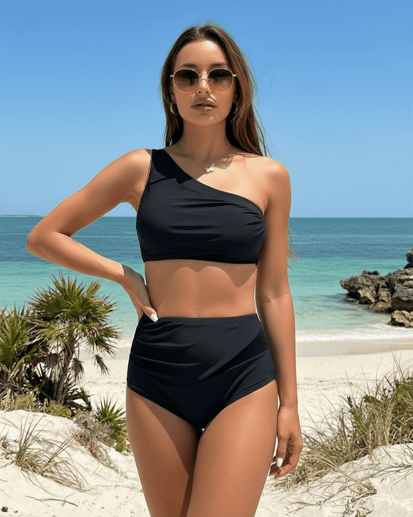 Midnight Two-Piece Swimsuit by Lauven showcasing an elegant asymmetric design in a sophisticated setting.