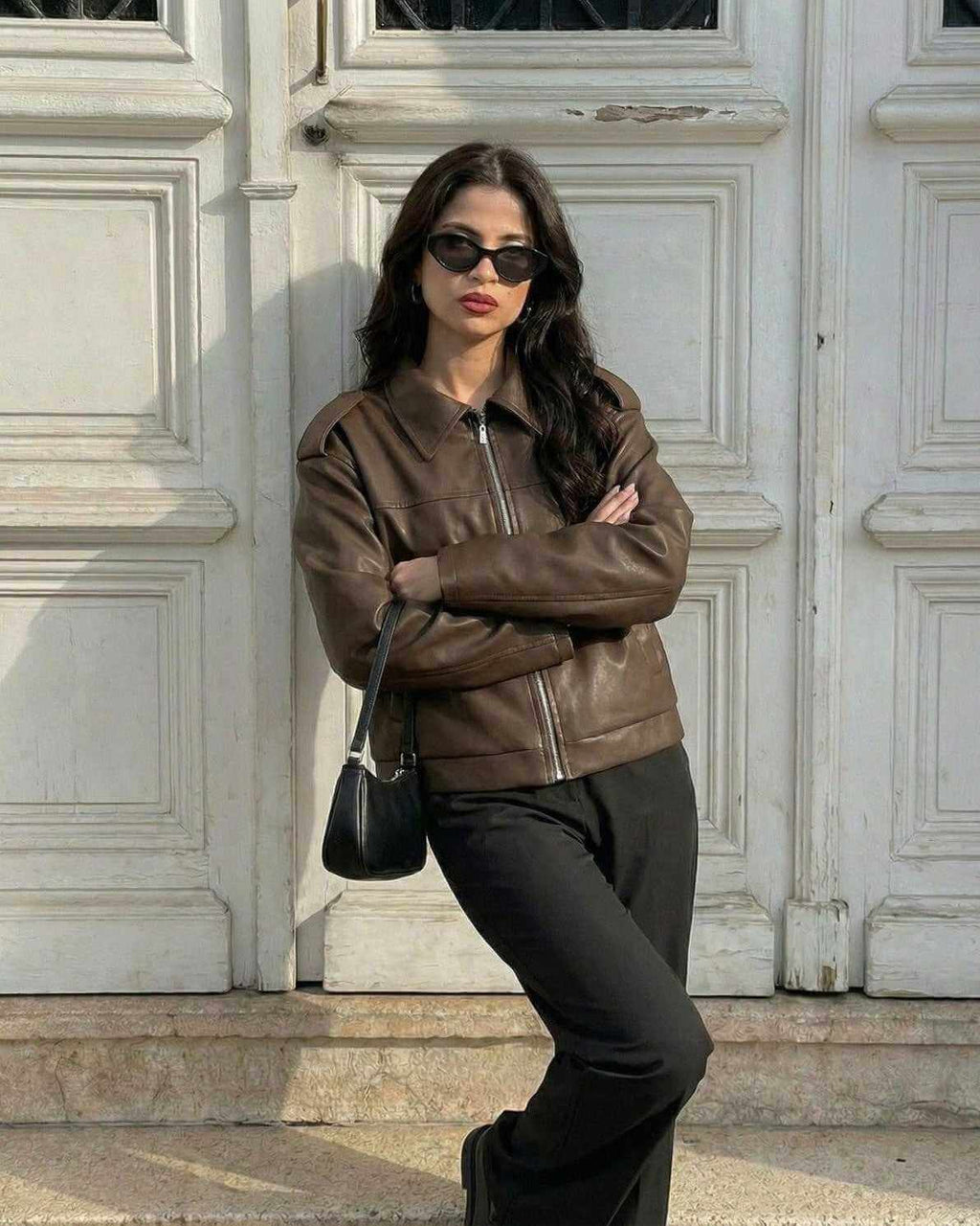 Women wearing a Milano Jacket by Lauven, showcasing a brown leather design for fall streetwear style.