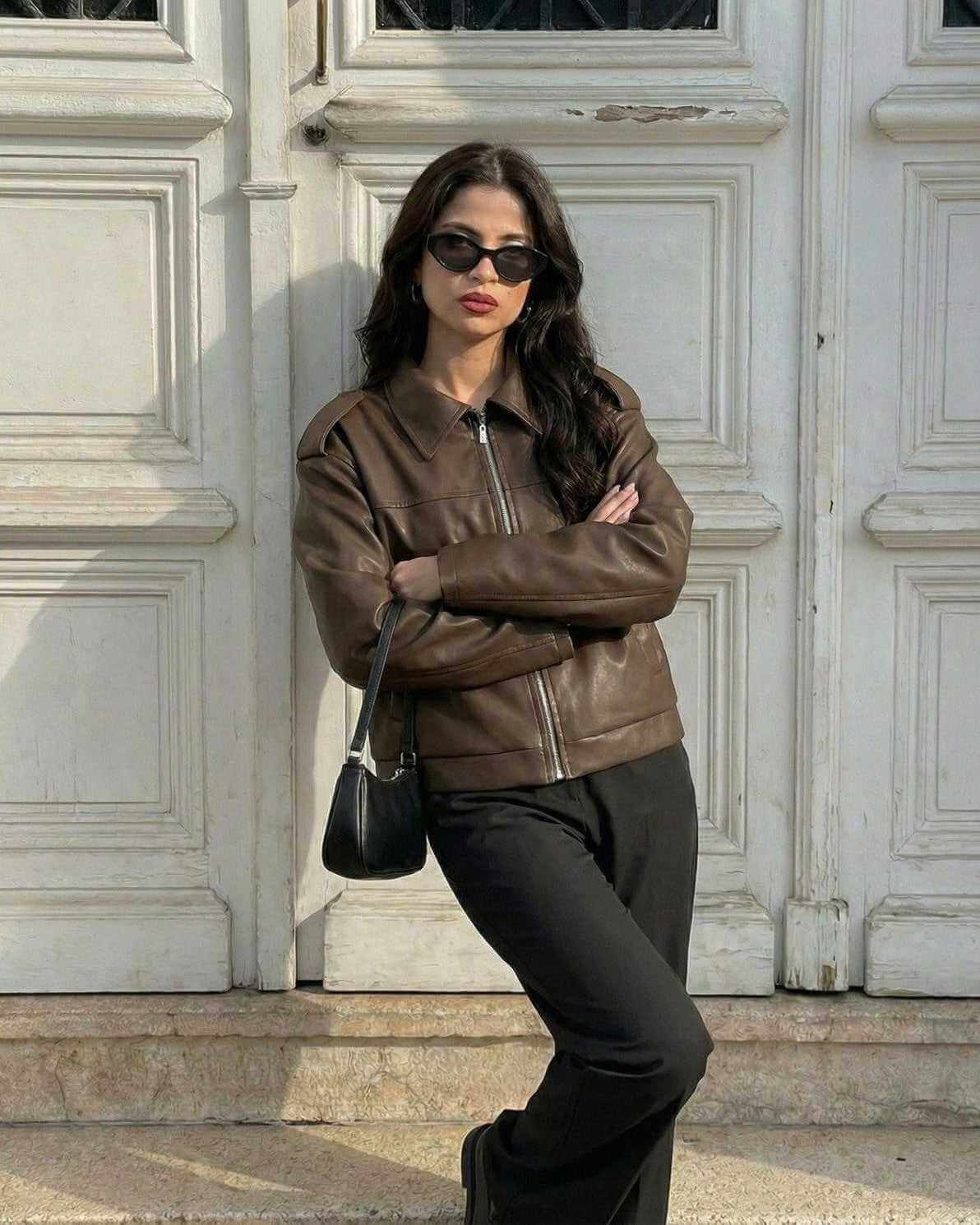 Women wearing a Milano Jacket by Lauven, showcasing a brown leather design for fall streetwear style.