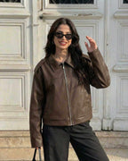 Woman wearing Milano Jacket by Lauven, a stylish brown leather jacket for fall streetwear and casual style.