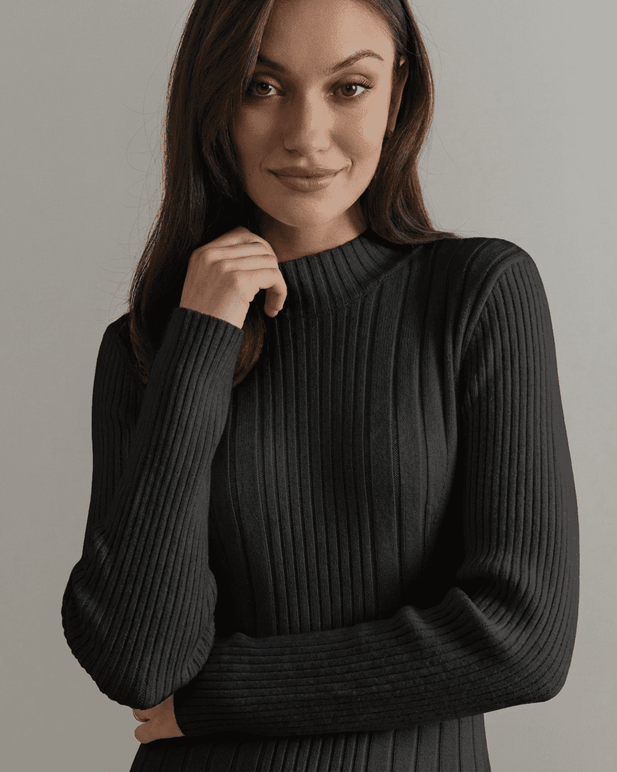 Model wearing the Milano Mini Dress by Lauven, featuring ribbed knit and mock neck design.
