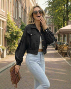 Monaco Jacket by Lauven - Women's black cropped jacket with lantern sleeves in a street style setting.