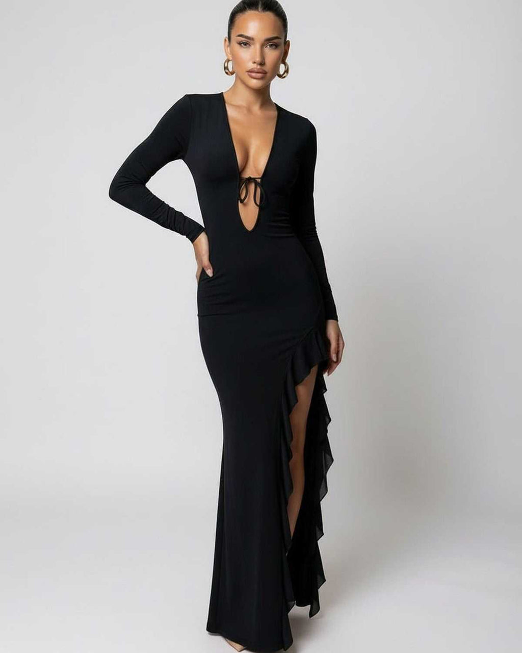 Monaco Maxi Dress featuring a deep V-neck, long sleeves, and a high slit with ruffles, by Lauven.