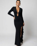 Monaco Maxi Dress featuring a deep V-neck, long sleeves, and a high slit with ruffles, by Lauven.