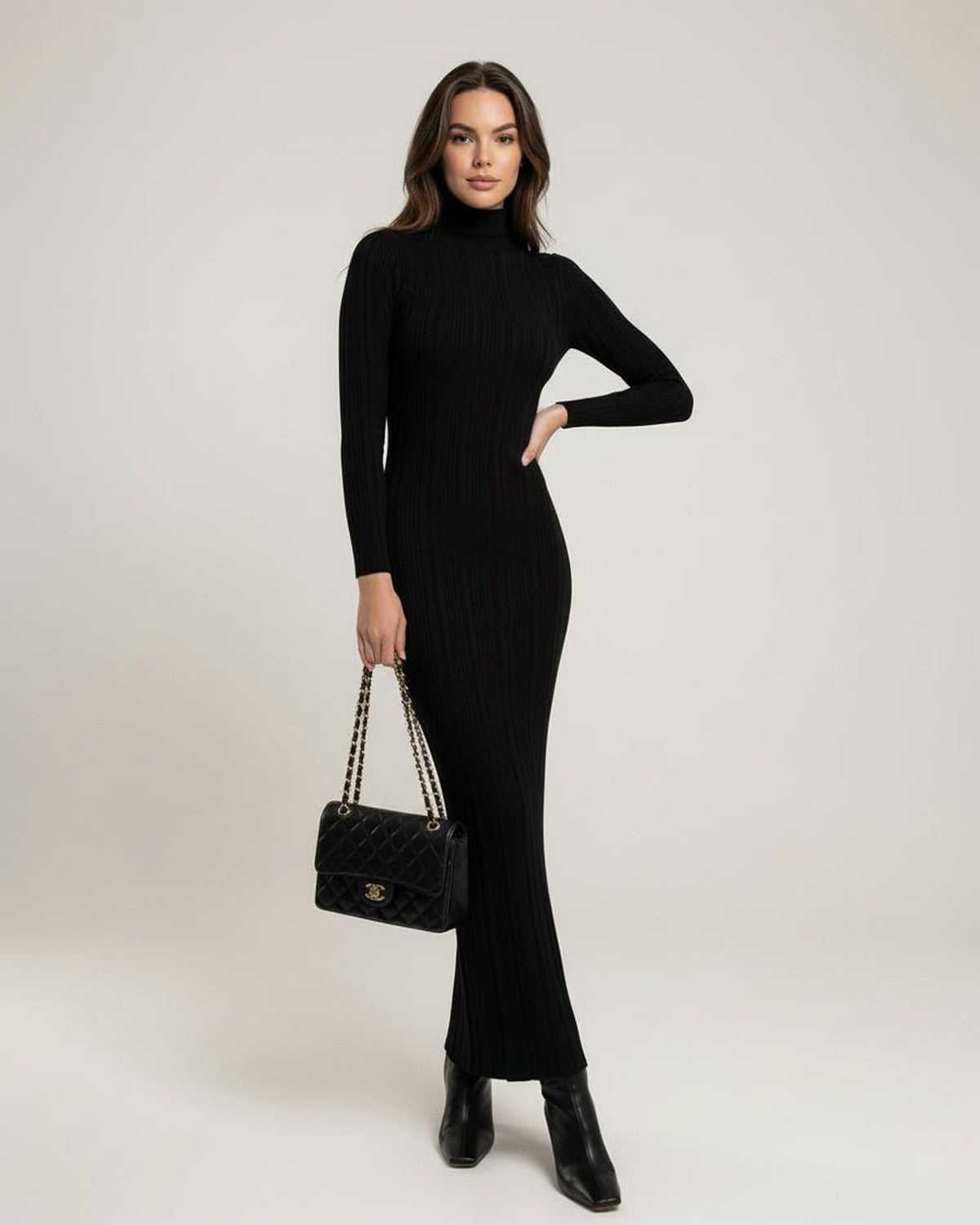 Monaco Maxi Dress featuring a sleek black ribbed knit design and turtleneck, showcasing a chic minimalist style by Lauven.