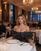 Monaco Maxi Dress on model in elegant restaurant, featuring ruffles and structured fit, by Lauven.