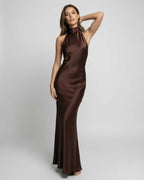 Monaco Maxi Dress | Elegant brown satin maxi dress with halter neck by Lauven, showcasing a fluid silhouette and polished look.