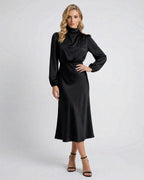 Lauven Monaco Midi Dress in black satin, featuring high neck, long sleeves, perfect for elegant day-to-evening wear.