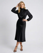 Lauven Monaco Midi Dress in black satin, high neck, long sleeves, showcasing elegance and versatility.