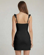 Monaco Mini Dress back view showing ruffle trim, bodycon fit, and black smooth stretch knit fabric from Lauven.