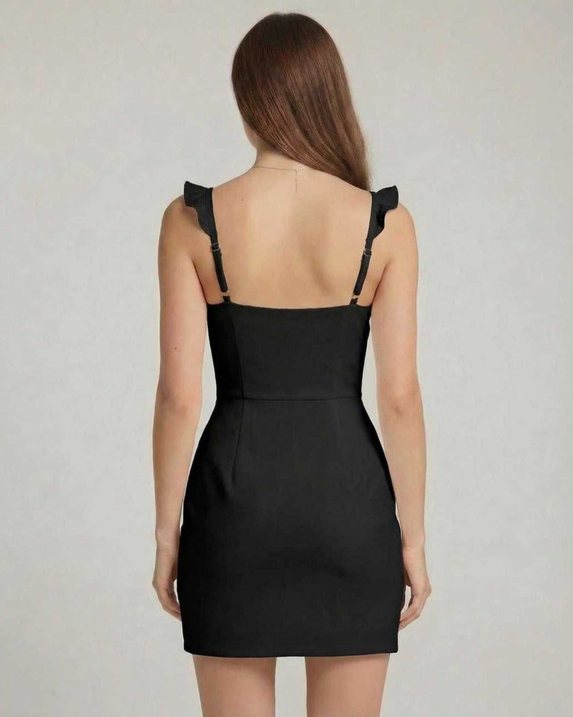 Monaco Mini Dress back view showing ruffle trim, bodycon fit, and black smooth stretch knit fabric from Lauven.