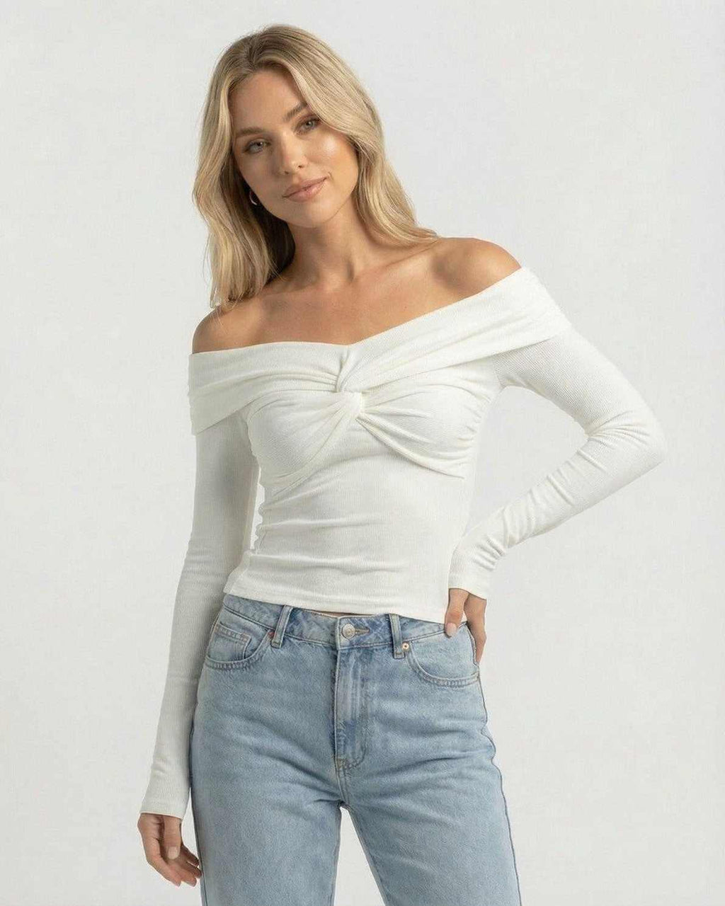 Monaco Top by Lauven – Women’s off the shoulder long sleeve white top in ribbed knit with twist-front detail.