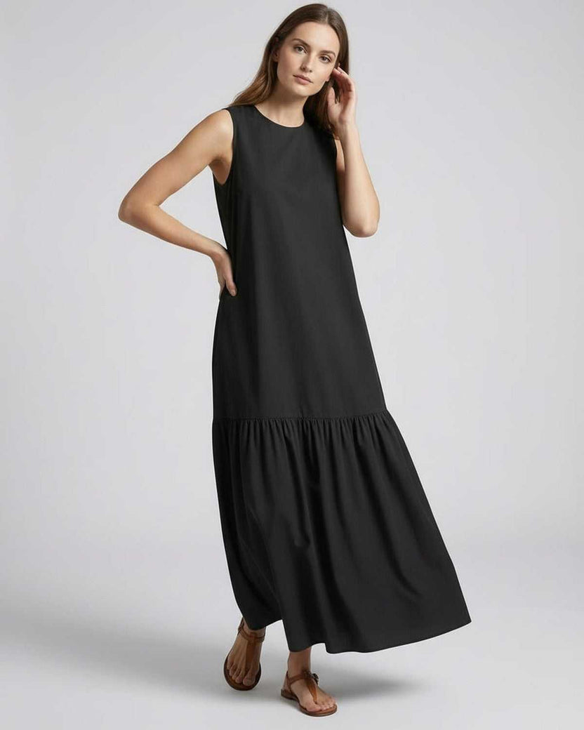 Nocta Midi Dress showcasing a relaxed silhouette and fluid movement in timeless black for effortless everyday style.
