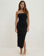 Noctis Midi Dress by Lauven - Sleek strapless black sheath with a side slit, perfect for elegant evening wear.